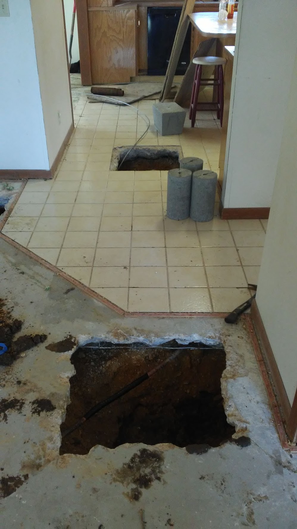 Breaking home tile to fix a leak